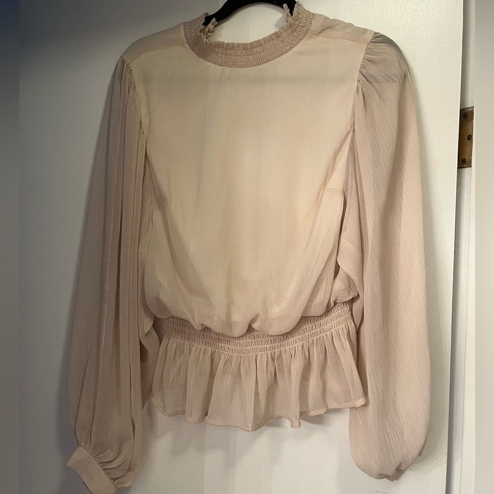 Women’s long sleeve peplum blouse size L